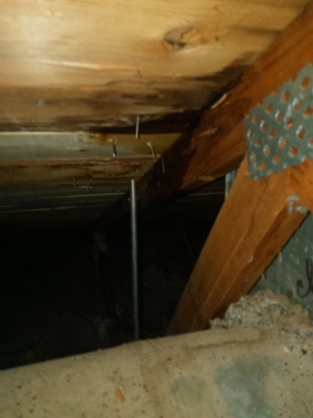 Water damage found on attic rafters during an inspection
